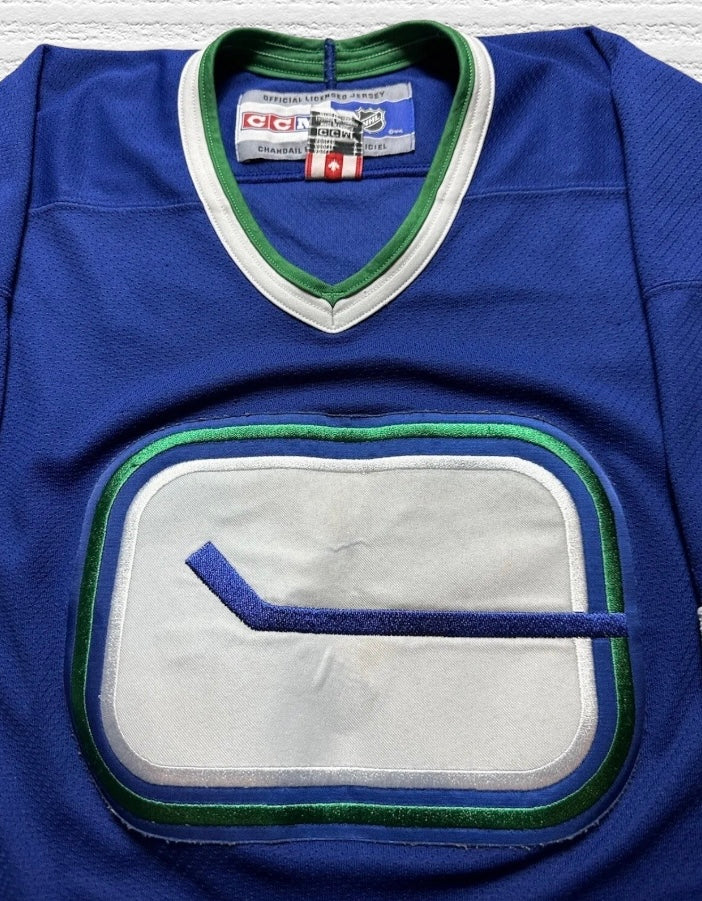 Vancouver Canucks CCM Stick in Rink Jersey Size (L)